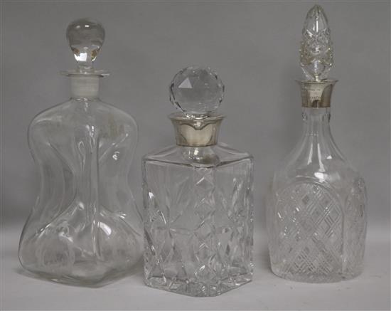 Two silver mounted decanters and a Dutch decanter tallest 30cm